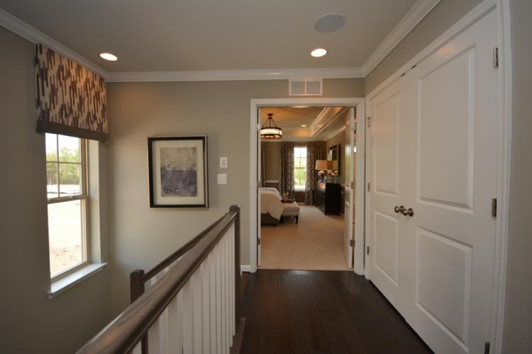 The upper level hallway leading to the master bedroom in the Riley II.