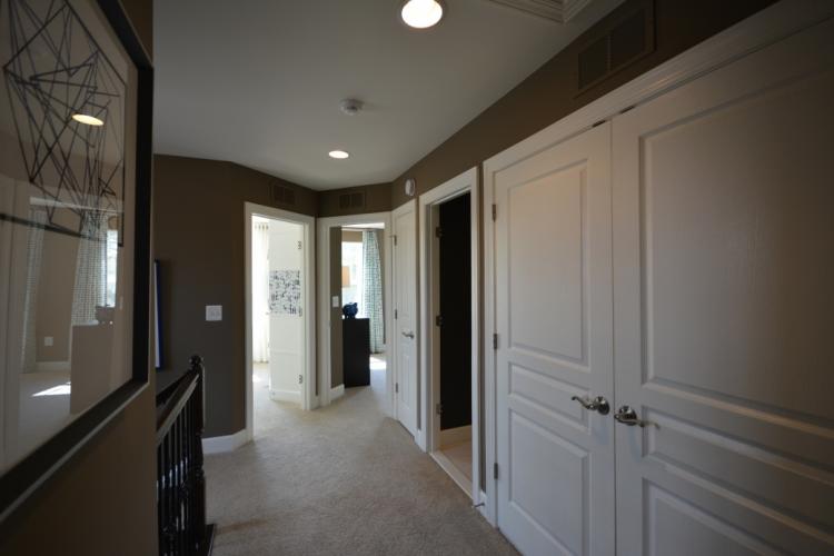 Entries to the upper level hallway bathroom and bedrooms #2 and #3.