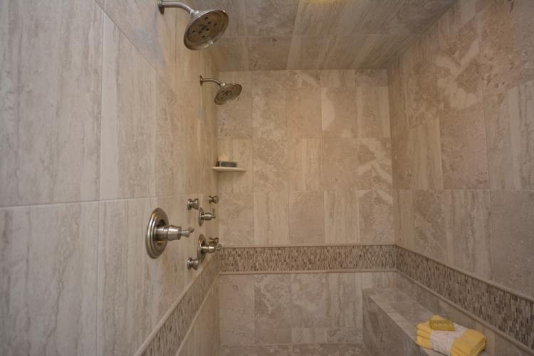 The master bathroom shower with tile surround.