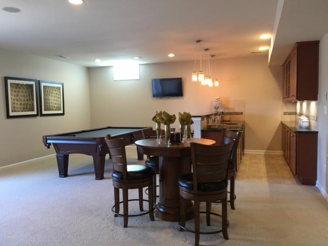 The basement wet bar and recreation room.