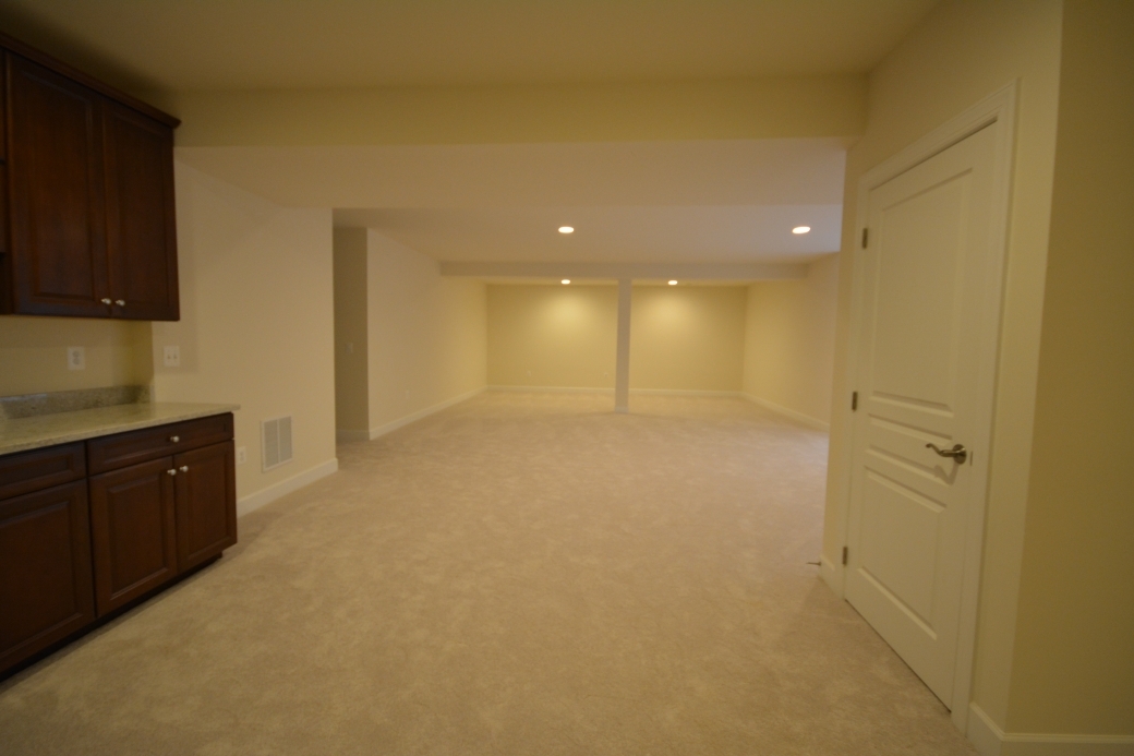 The basement recreation room with wet bar.