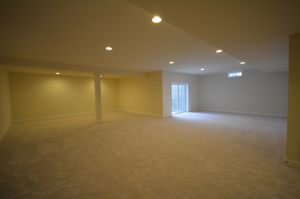 The basement recreation room (24'-8" by 16'-0").