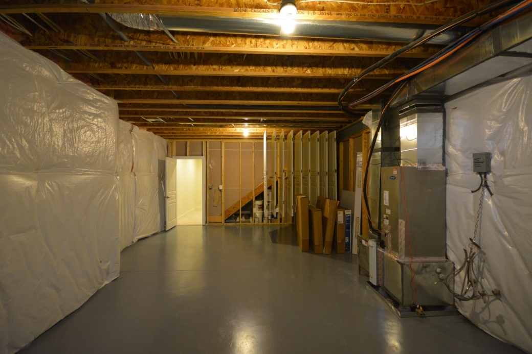Unfinished storage room (13'-6" by 18'-0").