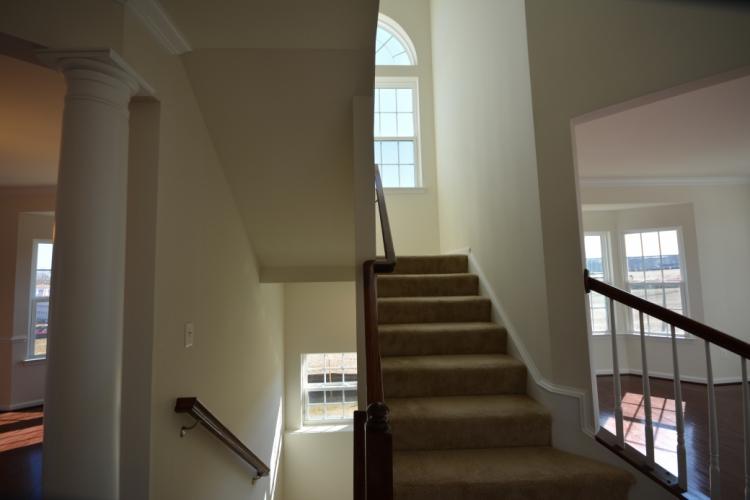 The stairway between the main floor and basement.