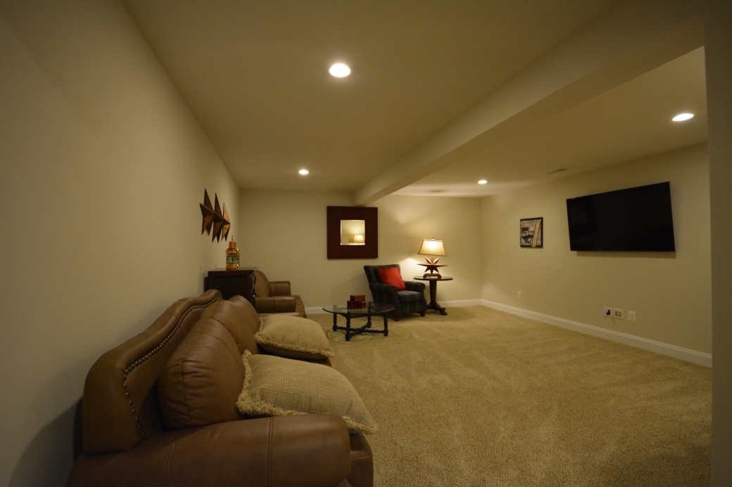 The basement media room (18'-4" by 16'-8").