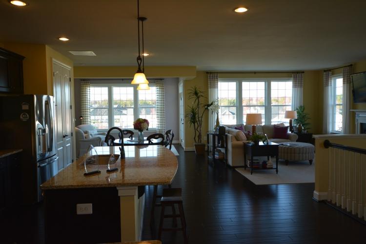 The Claremont kitchen, sun room, and family room.