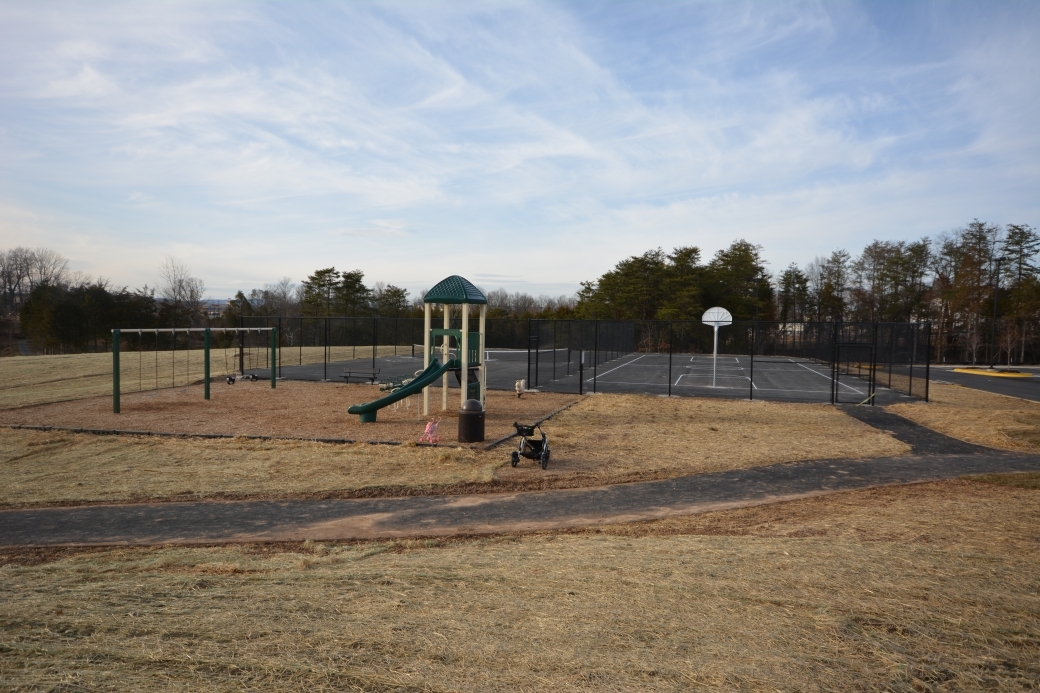 The Wentworth Green tennis courts, playground, and walking trail.