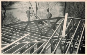 Carpenters framing the great room of "Alvictus." Lake Jackson (Manassas, Virginia) is in the background.