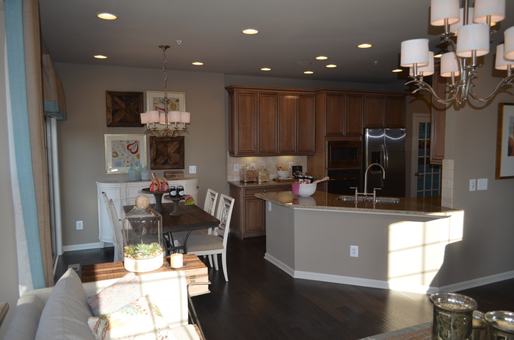This is the breakfast area and kitchen in the Easton luxury town home at the Manors at Moorefield Green. This home has 3,000 finished square feet, 2 car garage, and an optional rooftop terrace with loft or fourth bedroom on 4 floors. This Toll Brothers home is 1 mile from the Dulles Silver Line Metro Station.