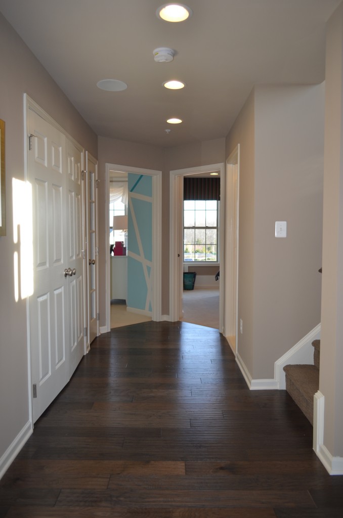 This is the bedroom hallway in the Easton floor plan luxury town home at the Manors at Moorefield Green. This home has 3,000 finished square feet, 2 car garage, and optional rooftop terrace with loft or fourth bedroom on the fourth floor. This Toll Brothers home is 1 mile from the Dulles Airport Silver Line Metro Station.