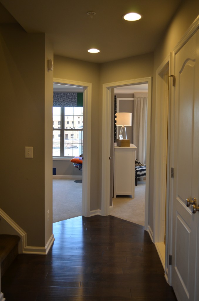 The bedroom hallway in the Bethesda luxury townhouse by Toll Brothers in the Manors at Moorefield Green in Ashburn, Virginia.