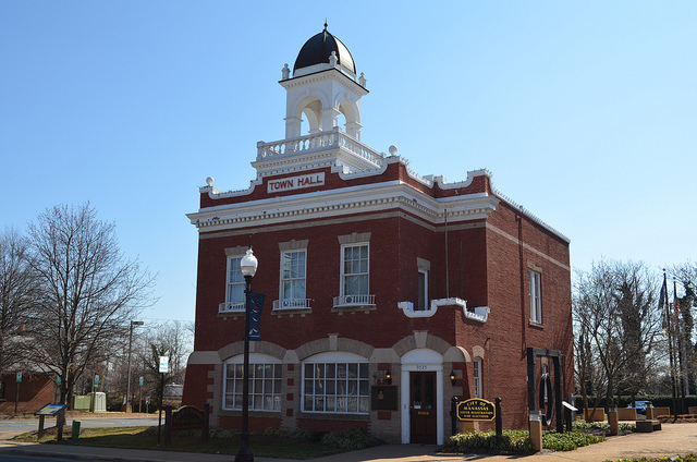 The Harry J. Parrish Town Hall Building in the Historic District of the City of Manassas. Built in 1914 after the Manassas Business District Fire of 1905, the Manassas Volunteer Fire Department occupied the first floor. This was the first fire department in Prince William County. Architect Albert Speiden designed the Manassas Town Hall Building.